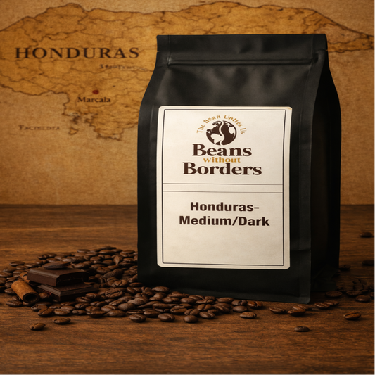 Coffee bag labeled 'Beans without Borders' on a wooden surface with coffee beans and a world map in the background.